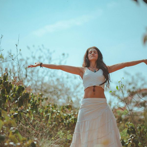 Person meditating peacefully in a calm, focused environment.